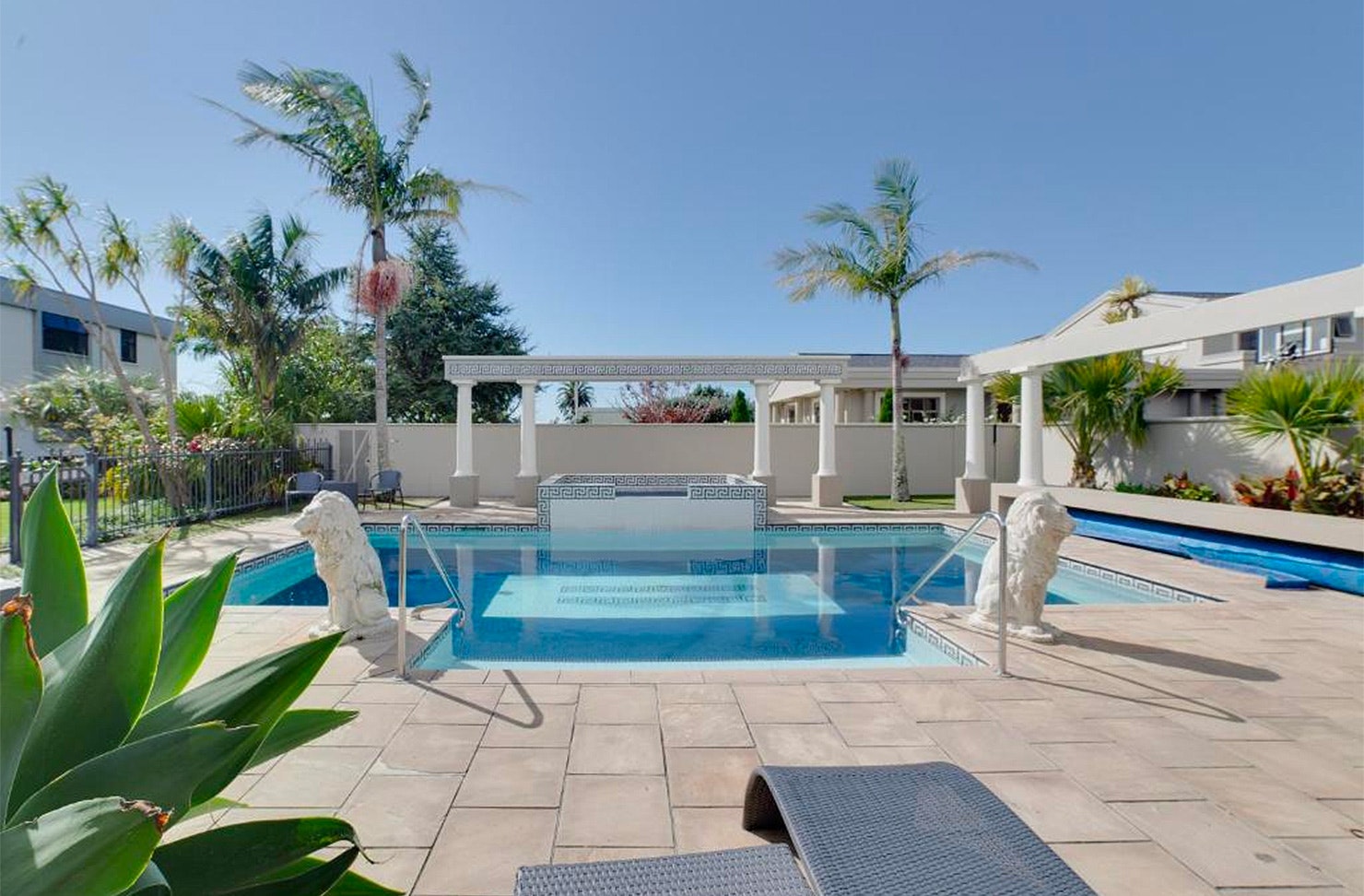 The lovely looking outdoor area and pool of the Devon Hotel in New Plymouth, one of the best hotels in New Plymouth.